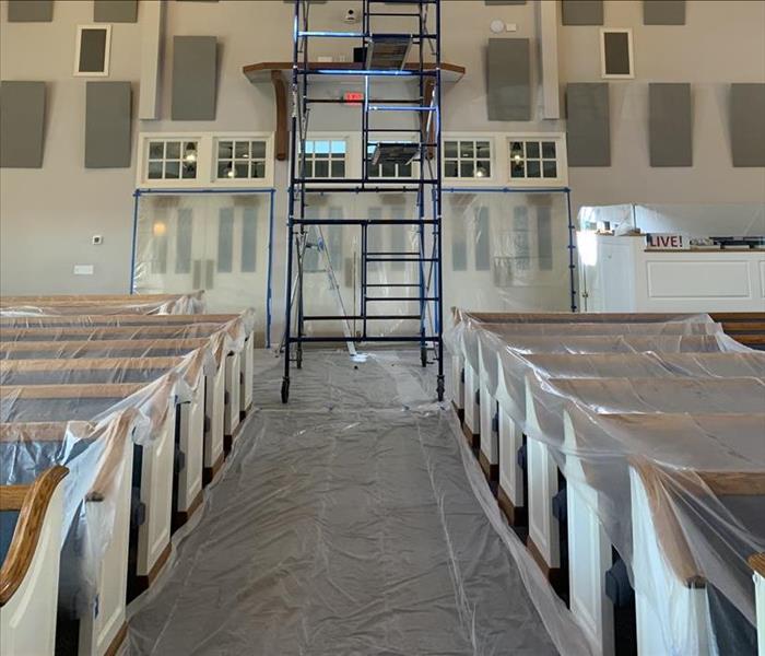 poly sheets covering interior of church