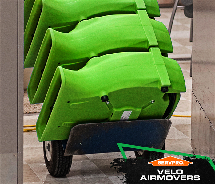 stackof air movers on a cart